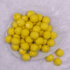 Top view of a pile of 20mm Yellow Faceted Opaque Bubblegum Beads