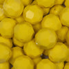 Close up view of a pile of 20mm Yellow Faceted Opaque Bubblegum Beads
