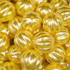 Close up view of a pile of 20mm Yellow Pearl Pumpkin Shaped Bubblegum Bead