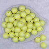 Top view of a pile of 20mm Pastel Yellow Plaid Print Bubblegum Beads