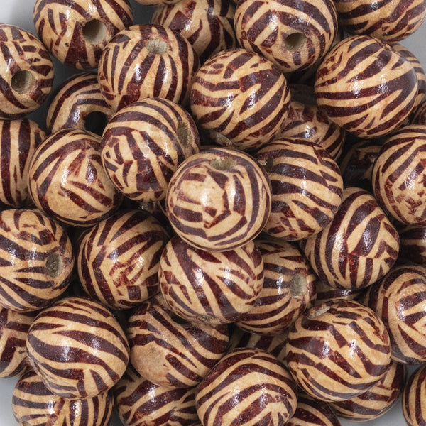 Close up view of a pile of 20mm Zebra Print Wooden Beads