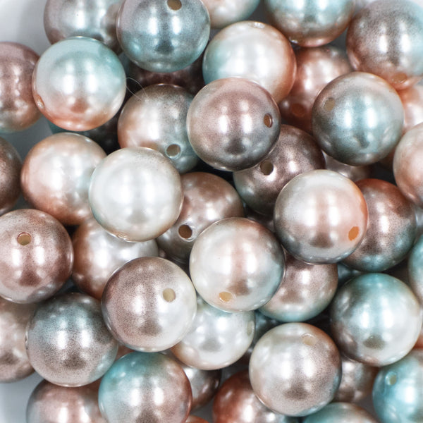 Close up view of a pile of 20mm Blue/Brown Ombre Shimmer Faux Pearl Bubblegum Beads