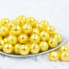 front view of a pile of 20mm Yellow Disco Faceted Pearl Chunky Bubblegum Beads