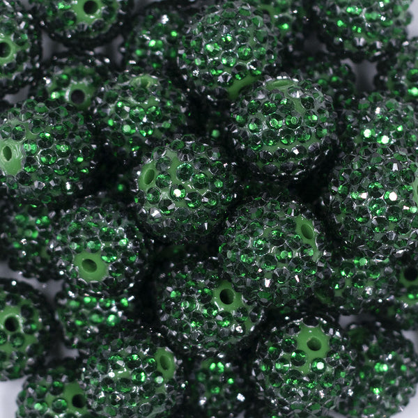 Close up view of a pile of 20mm Emerald Green Rhinestone Bubblegum Beads