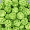 Close up view of a pile of 20mm Ball Bead Green Bubblegum Beads