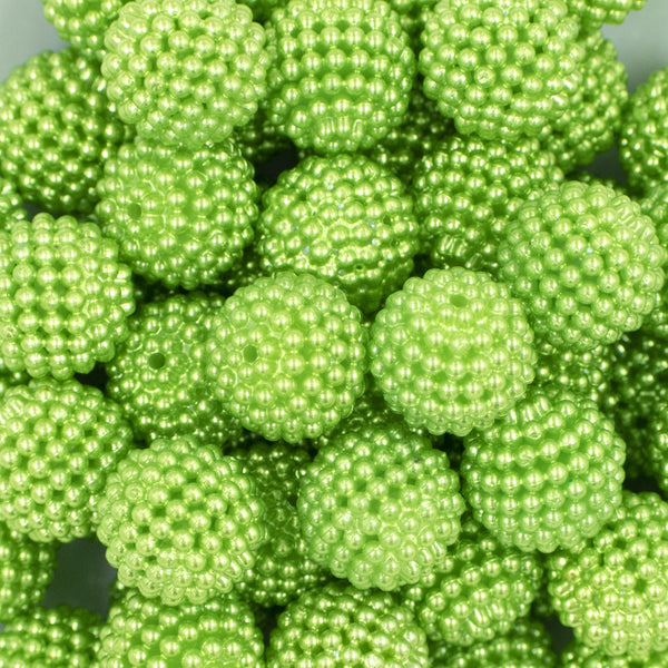 Close up view of a pile of 20mm Ball Bead Green Bubblegum Beads