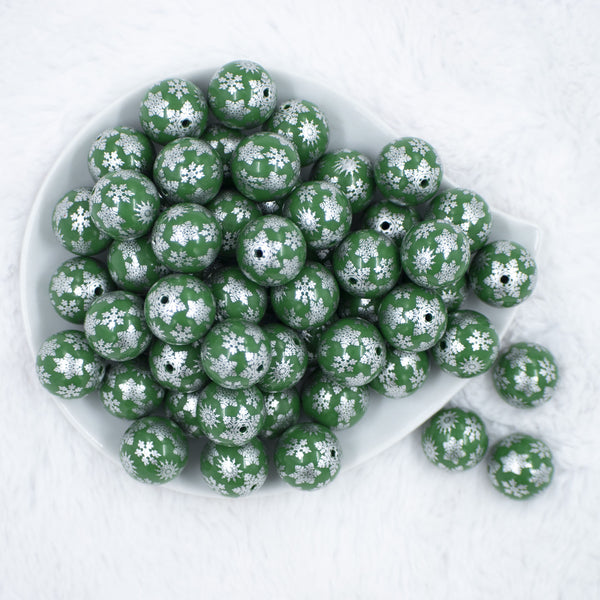 Top view of a pile of 20mm Silver Snowflake Print on Green Acrylic Bubblegum Beads