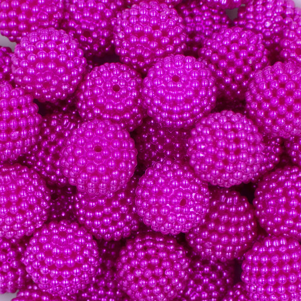 Close up view of a pile of 20mm Ball Bead Hot Pink Bubblegum Beads