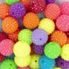Close up view of a pile of 20mm NEON Rhinestone Clear Mix Acrylic Bubblegum Beads Bulk [100 Count]