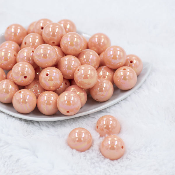Front view of a pile of 20mm Peach Solid AB Bubblegum Beads