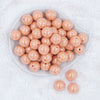 Top view of a pile of 20mm Peach Solid AB Bubblegum Beads