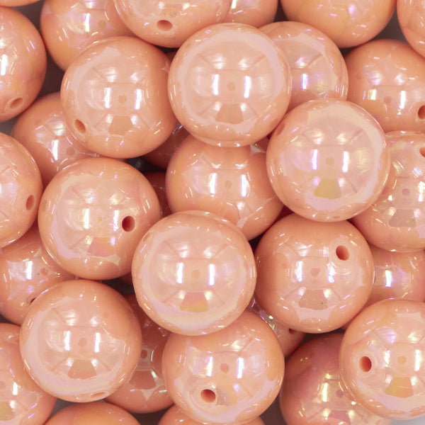Close up view of a pile of 20mm Peach Solid AB Bubblegum Beads