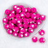 top view of pink with white hears 20mm Bubblegum Bubblegum Beads on a white plate with white background
