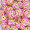 Close up view of a pile of 20mm Pink & Yellow Striped Rhinestone AB Bubblegum Beads
