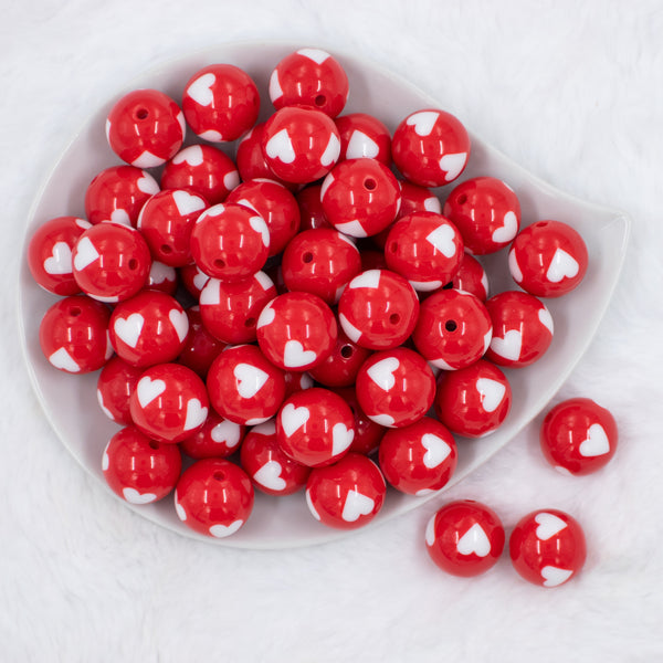 top view of a pile of 20mm Red with White Hearts Acrylic Bubblegum Beads