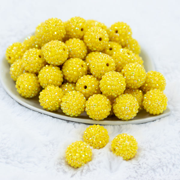Front view of a pile of 20mm Sunshine Yellow Rhinestone AB Bubblegum Beads