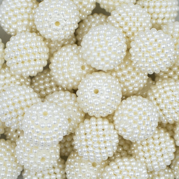 Close up view of a pile of 20mm Ball Bead White Bubblegum Beads