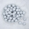 Top view of a pile of 20mm Silver Snowflake Print on White Acrylic Bubblegum Beads