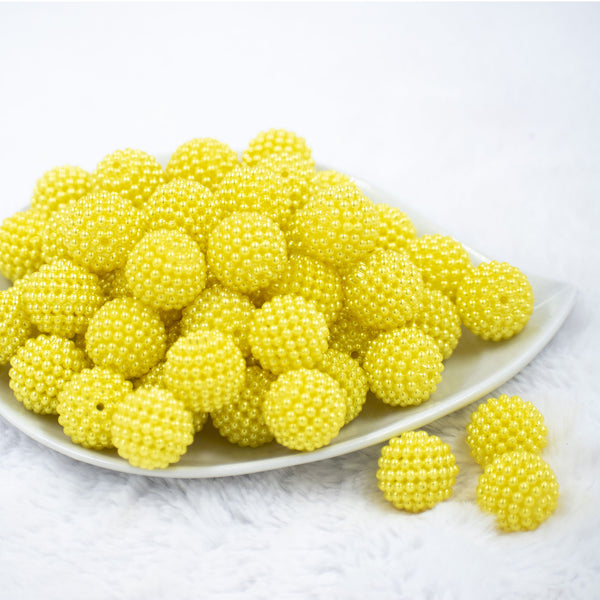 Front view of a pile of 20mm Ball Bead Yellow Bubblegum Beads