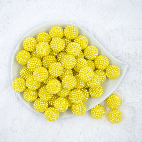 Top view of a pile of 20mm Ball Bead Yellow Bubblegum Beads