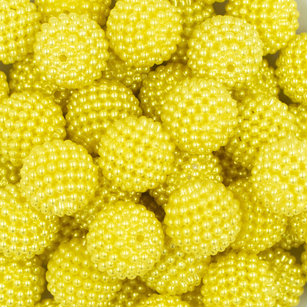Close up view of a pile of 20mm Ball Bead Yellow Bubblegum Beads
