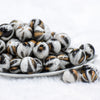 front view of a pile of 20mm Snow Leopard Animal Print Acrylic Bubblegum Beads
