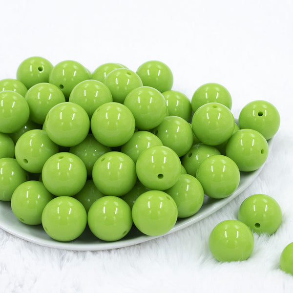 Front view of a pile of 20mm Apple Green Solid Acrylic Chunky Bubblegum Beads