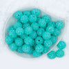 top view of a pile of 20mm Chunky Bubblegum Beads in a Aqua Blue with prism Rhinestone finish