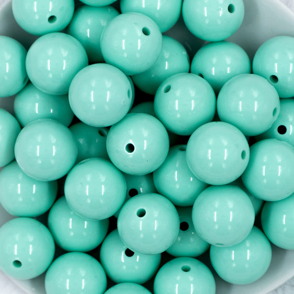 close-up view of a pile of 20mm Aqua Blue Solid Chunky Bubblegum Beads