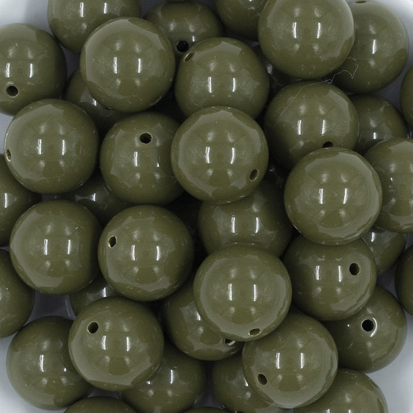 Close up view of a pile of 20mm Army Green Solid Acrylic Chunky Bubblegum Beads