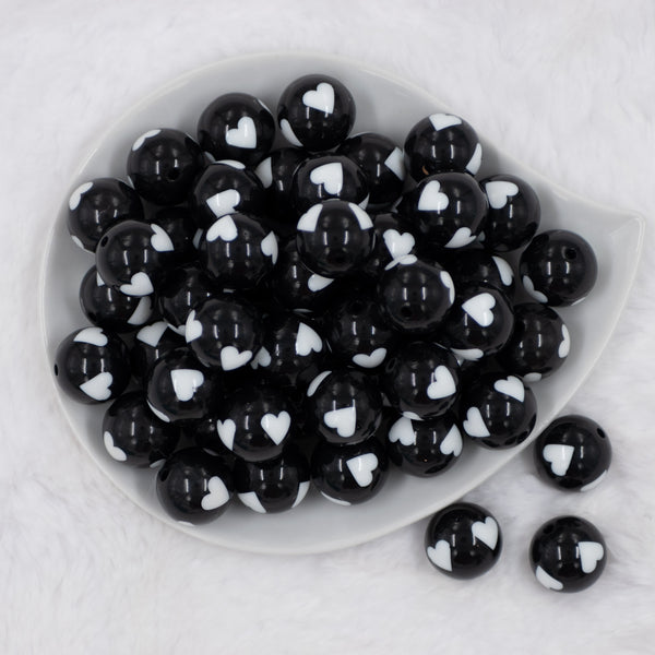 top of a pile of 20mm Black with White Hearts Bubblegum Beads