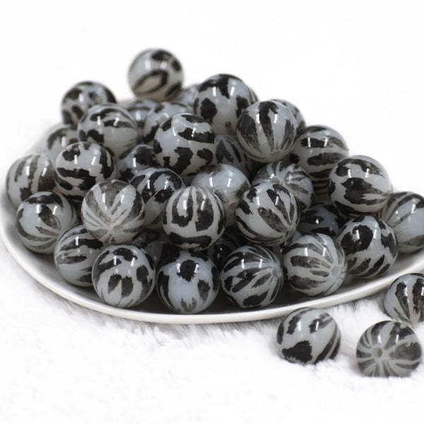 Front view of a pile of 20mm Black & Gray Faded Cheetah animal print Bubblegum Beads