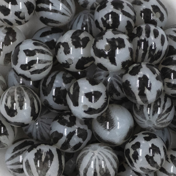 Close up view of a pile of 20mm Black & Gray Faded Cheetah animal print Bubblegum Beads