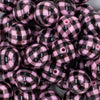 close-up view of a pile of 20mm Pink with Black Plaid Print Chunky Acrylic Bubblegum Beads
