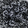 Close up view of a pile of 20mm Black & Silver Confetti Rhinestone AB Bubblegum Beads