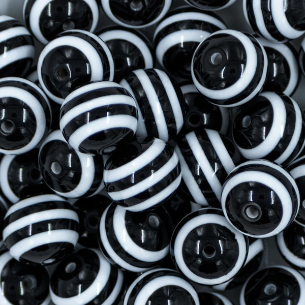 close-up of a pile of 20mm Black with White Striped Chunky Bubblegum Beads