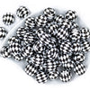 top view of many 20mm Black and White Diamond Print Chunky Acrylic Bubblegum Beads stacked in white dish