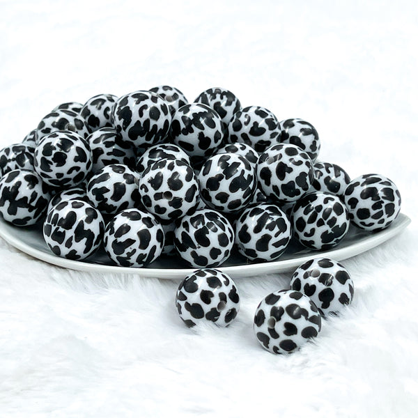 front of a pile of 20mm Black & White Cow Animal Print Bubblegum Beads