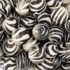 close up of a pile of 20mm Matte Zebra Animal Print - Brown & Tan - Acrylic Bubblegum Beads