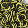Close up view of a pile of 20mm Yellow & Black Striped Chunky Bubblegum Beads
