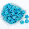 top view of a plate containing a pile of 20mm light blue super sparkly Rhinestone AB Chunky Bubblegum Beads