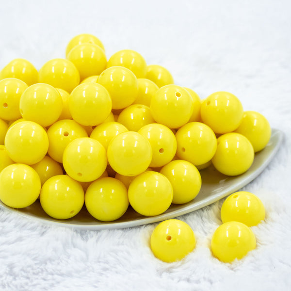 Front view of a pile of 20mm Bright Yellow Solid Acrylic Chunky Bubblegum Beads