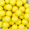 Close up view of a pile of 20mm Bright Yellow Solid Acrylic Chunky Bubblegum Beads
