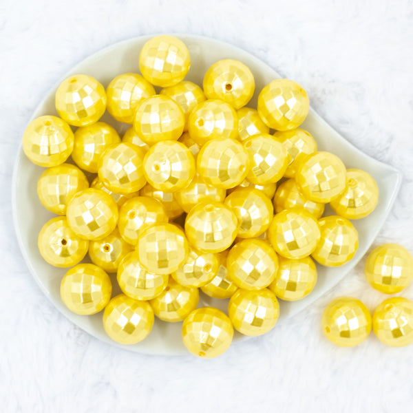 top view of a pile of 20mm Yellow Disco Faceted Pearl Chunky Bubblegum Beads