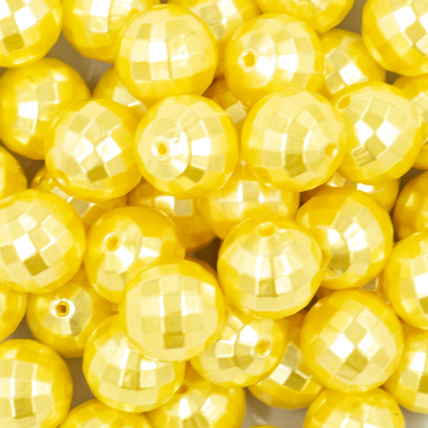 close-up view of a pile of 20mm Yellow Disco Faceted Pearl Chunky Bubblegum Beads