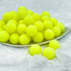 front of a pile of 20mm Neon Yellow Rhinestone Bubblegum Beads