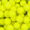 close up of a pile of 20mm Neon Yellow Rhinestone Bubblegum Beads