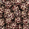 close-up of a pile of 20mm Cream & Brown Cow Animal Print Chunky Acrylic Bubblegum Beads