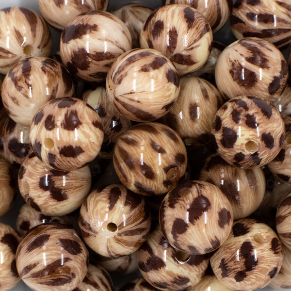 Close up view of a pile of 20mm Brown Leopard Animal Print Acrylic Bubblegum Beads