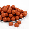 front view of a pile of 20mm Burnt Orange Solid Bubblegum Beads